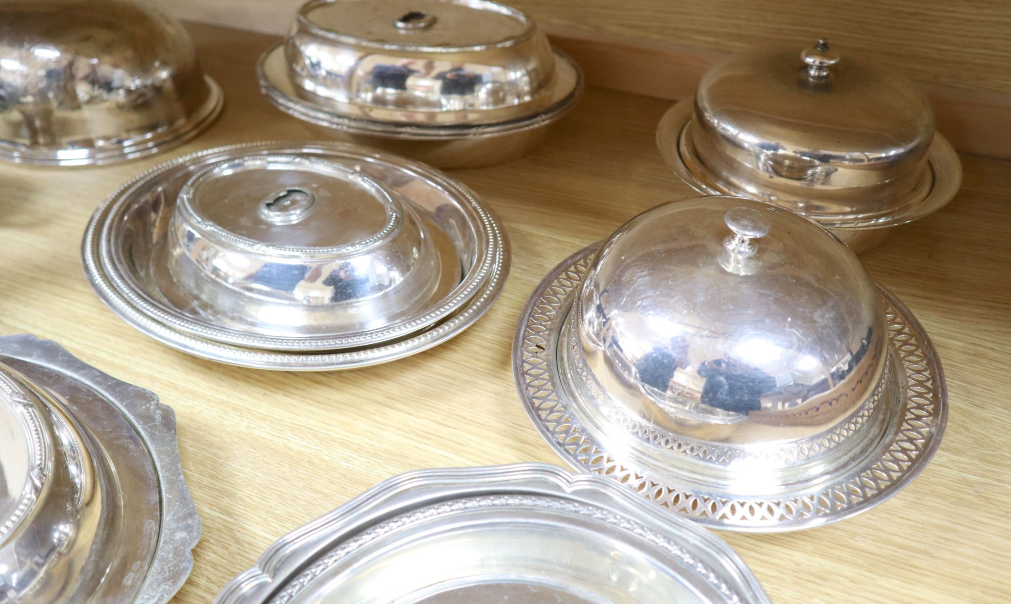 A quantity of plated items, including entree dishes and covers,